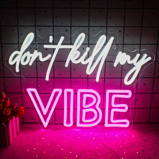 The image features a vibrant LED neon sign displaying the phrase "Don't Kill My Vibe" in a stylish cursive font.
