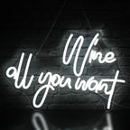 A imagem exibe uma vibrante placa de LED neon que diz "Vinho à vontade" em elegantes letras cursivas.