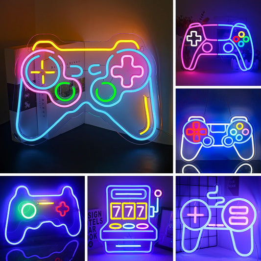 The image displays a vibrant LED neon sign in the shape of a video game controller.