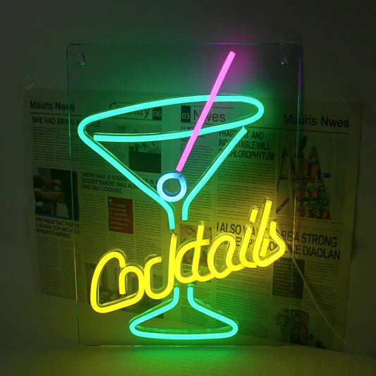 The image displays a vibrant green LED neon sign in the shape of a cocktail glass.