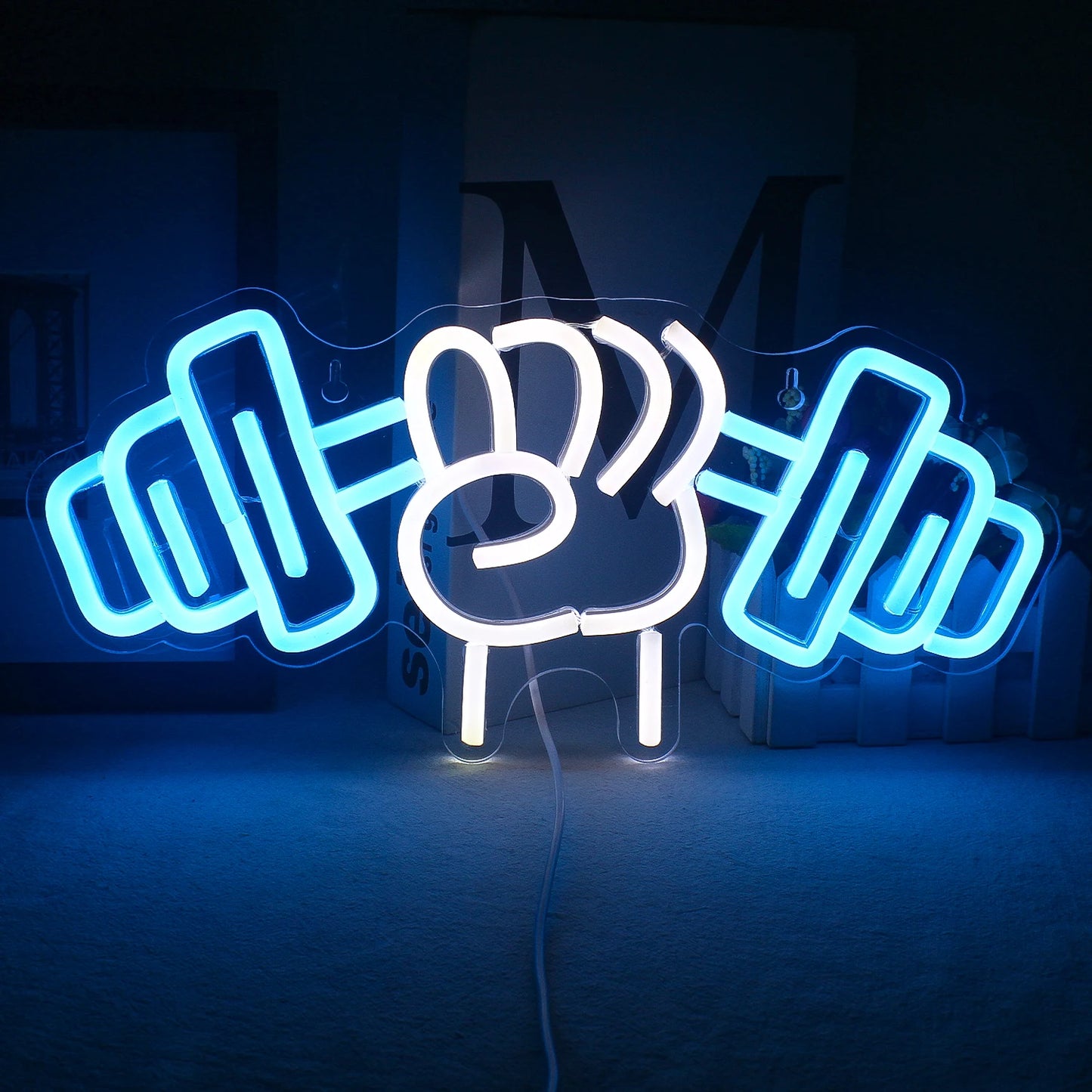 The image features a vibrant LED neon sign designed in the shape of a barbell weightlifting motif.