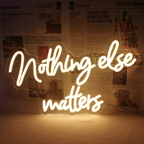 Uma placa de LED neon vibrante exibindo a frase "Nothing Else Matters" em uma fonte cursiva e elegante.