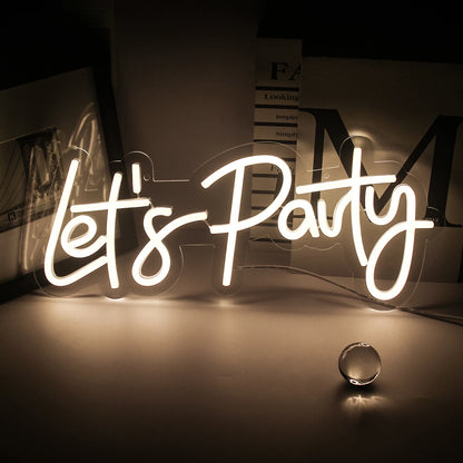 A vibrant "Let's Party" LED Neon Sign is displayed, featuring bold, cursive lettering.