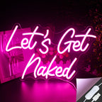 A imagem apresenta uma vibrante placa de LED neon exibindo a frase "Let's Get Naked" em uma fonte estilosa.