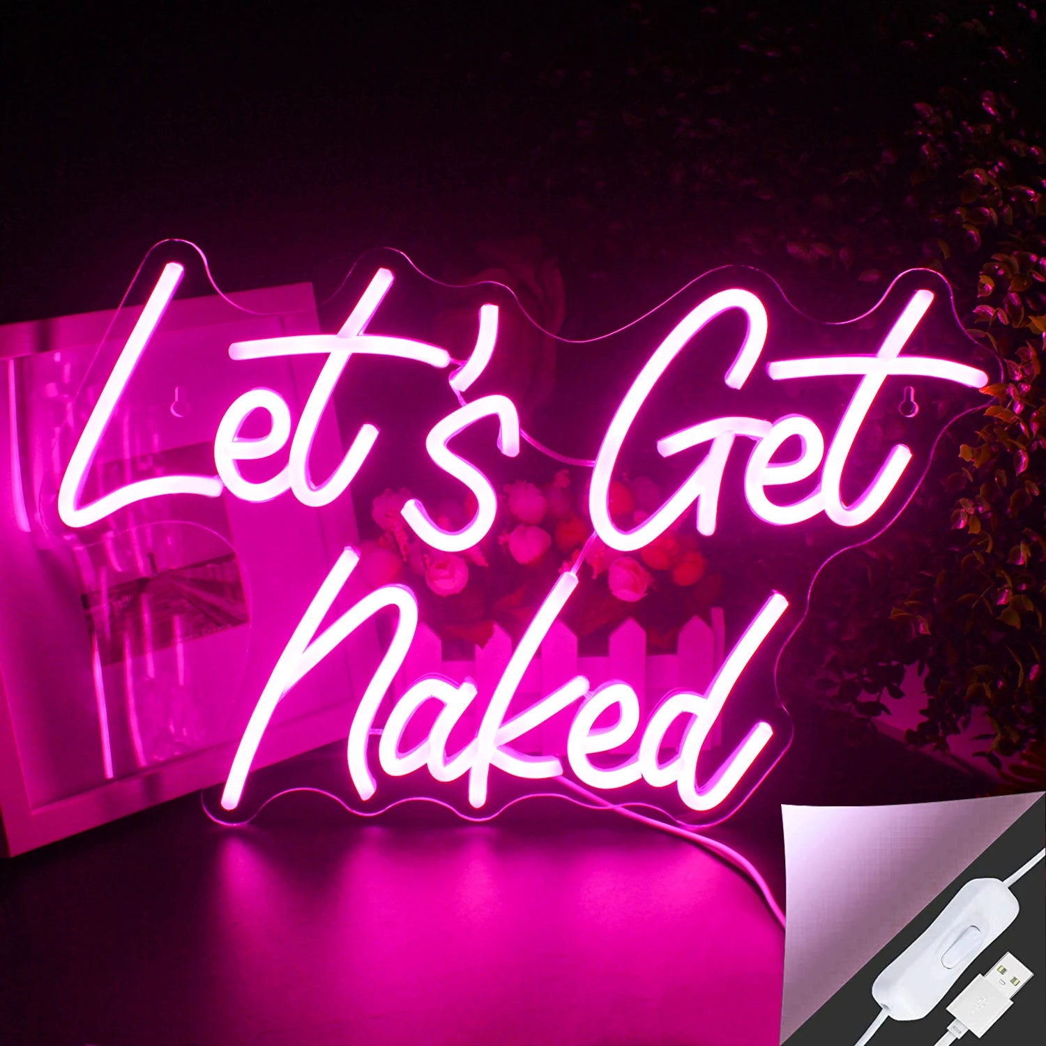 The image features a vibrant LED neon sign displaying the phrase "Let's Get Naked" in a stylish script font.