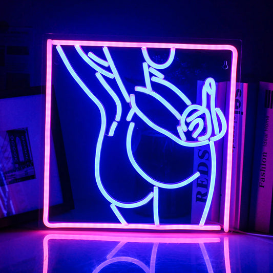 The image features a handmade LED neon sign depicting the silhouette of a woman’s body in a stylish and sensual pose.