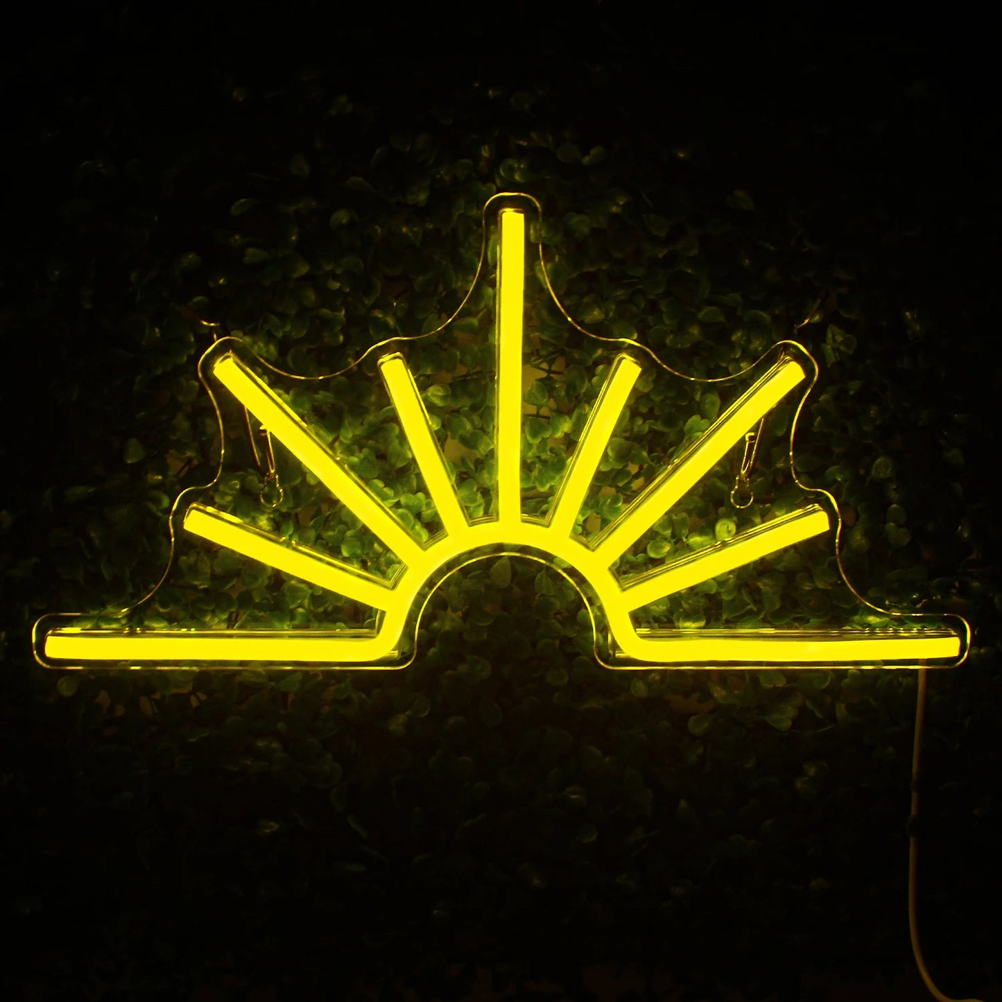 A vibrant Sun LED neon sign featuring a bright yellow sun with radiating beams surrounded by a warm glow.