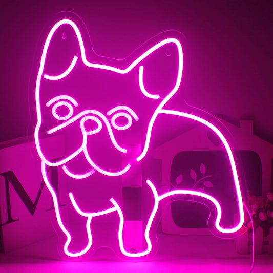 The image features a vibrant pink LED neon sign shaped in the outline of a dog.