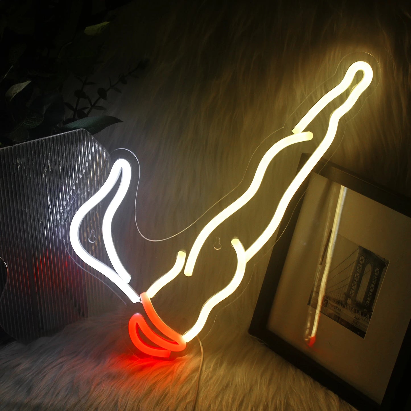 A vibrant LED neon sign depicting the word "Smoking" in bold, flowing cursive letters.
