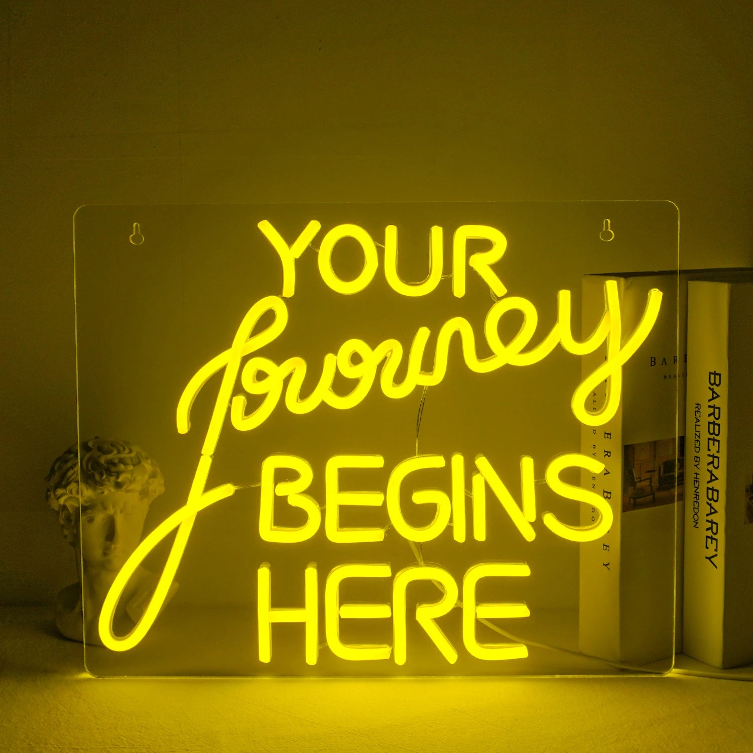 "A handcrafted LED neon sign displaying the words 'Journey Begin' in a flowing script font.