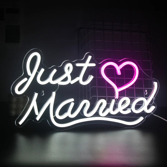 The image displays a vibrant "Just Married" LED neon sign.
