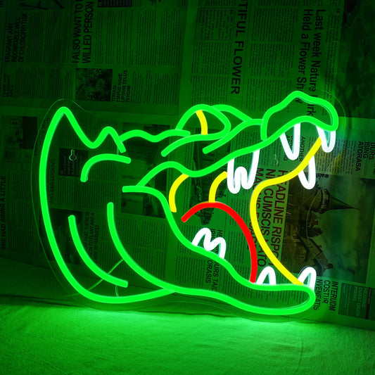 The image features a vibrant LED neon sign shaped like an alligator.