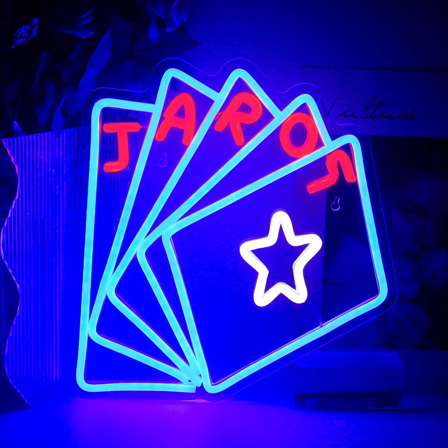The image features a vibrant LED neon sign shaped to spell the word "Poker.