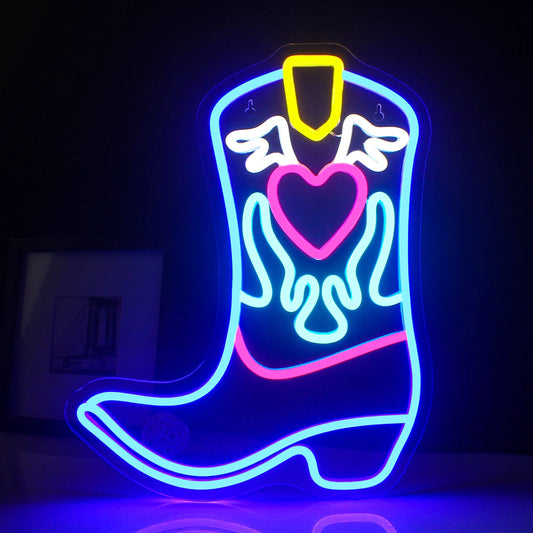 A vibrant LED neon sign shaped like a cowboy boot, glowing brightly in warm colors.
