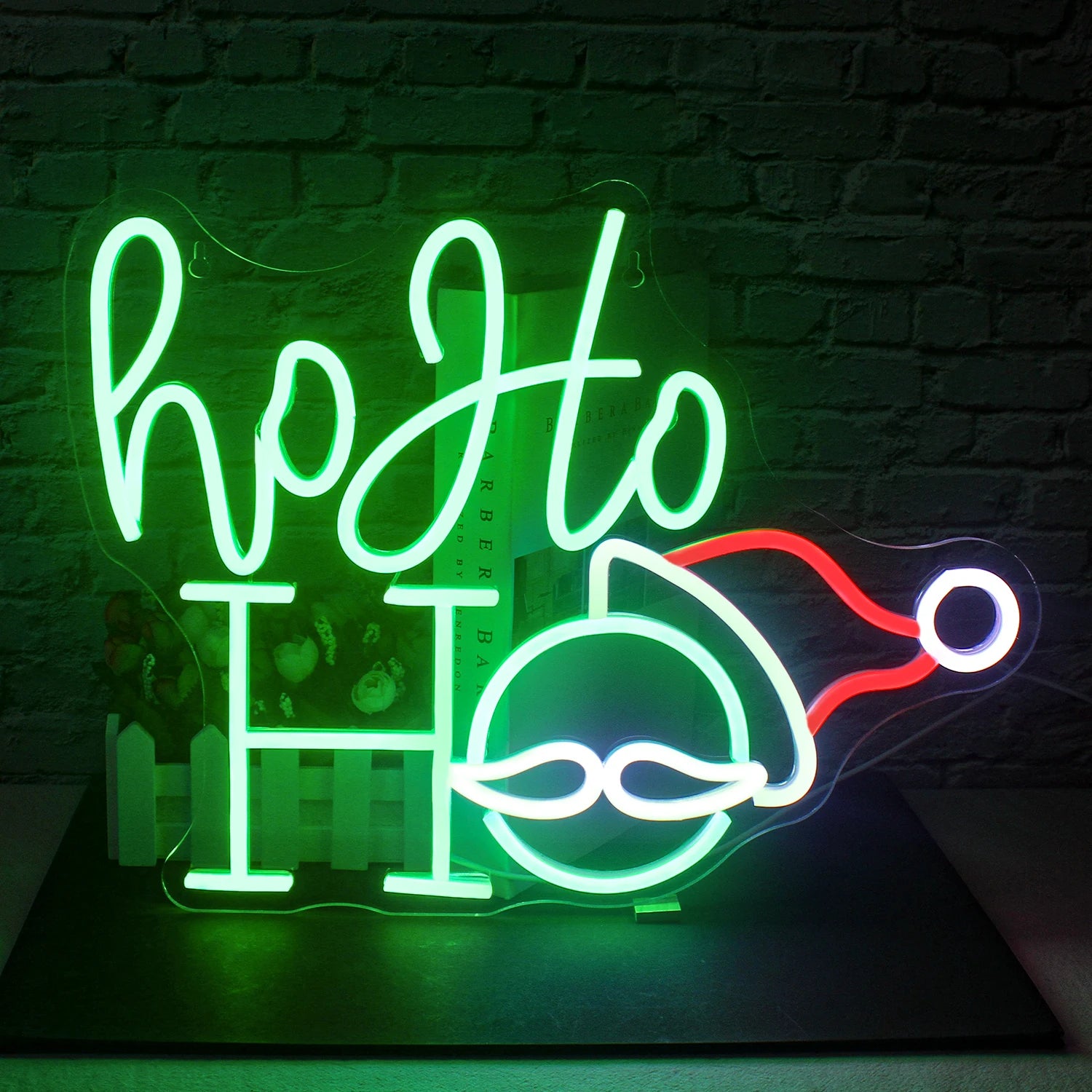 A vibrant LED neon sign displaying the words "Merry Christmas" in elegant, flowing script.