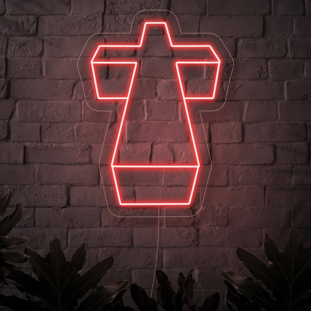 Um letreiro de neon iluminado com uma cruz sagrada