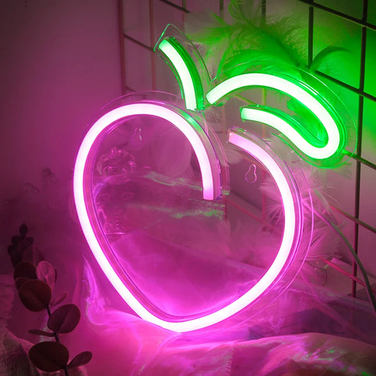 A stylishly designed Peach LED Neon Sign illuminates with a soft, warm glow.