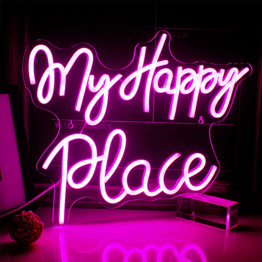 A vibrant "My Happy Place" LED neon sign is displayed prominently on a wall, casting a warm and inviting glow.