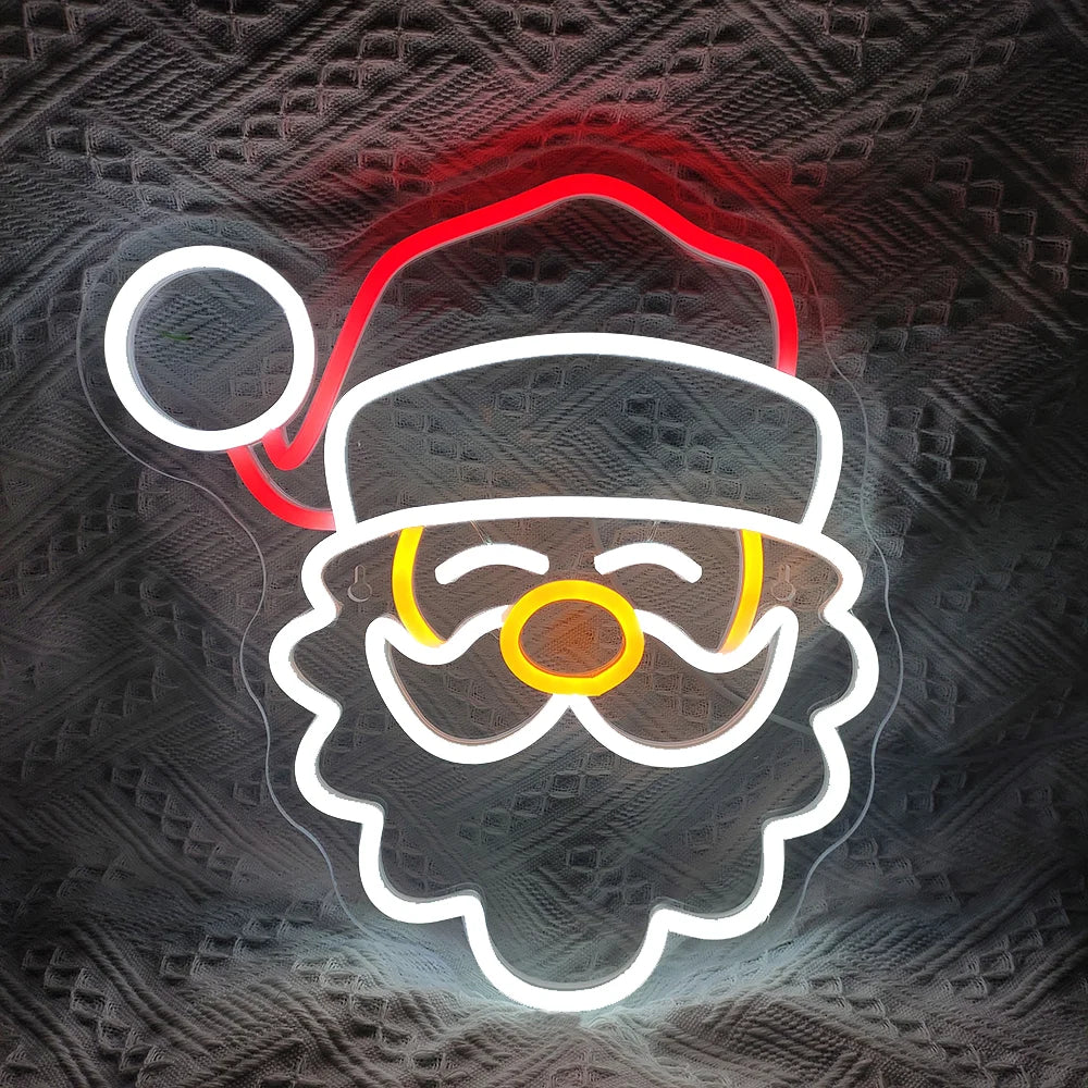 A imagem mostra uma placa de LED neon brilhante e festiva com os dizeres "Feliz Natal".
