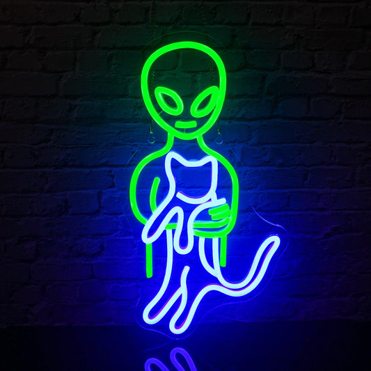The image displays a vibrant, budget-friendly LED neon sign in the shape of a green alien face.