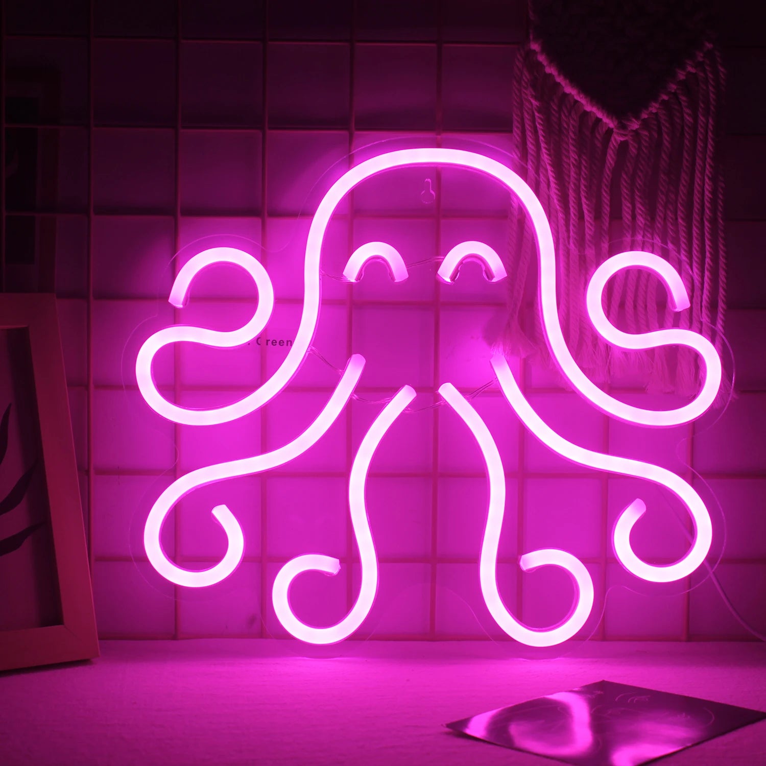 The image showcases a vibrant and colorful LED neon sign in the shape of an octopus.