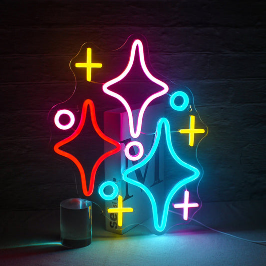 The image features a vibrant LED neon sign in the shape of a cluster of stars.