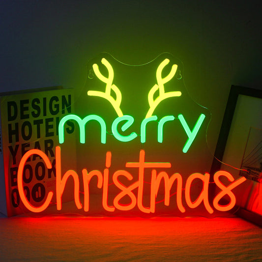 The image displays a handmade LED neon sign that brightly spells out "Merry Christmas" in an elegant, flowing script.