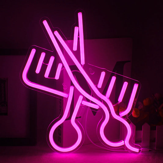Image A vibrant LED neon sign in the shape of a pair of scissors alongside a comb.