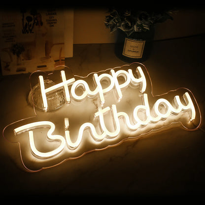 A vibrant "Happy Birthday" LED neon sign, featuring bright, multicolored letters in a playful script font.