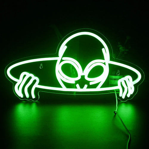 Um letreiro de LED neon vibrante em formato de cabeça alienígena, com grandes olhos amendoados.