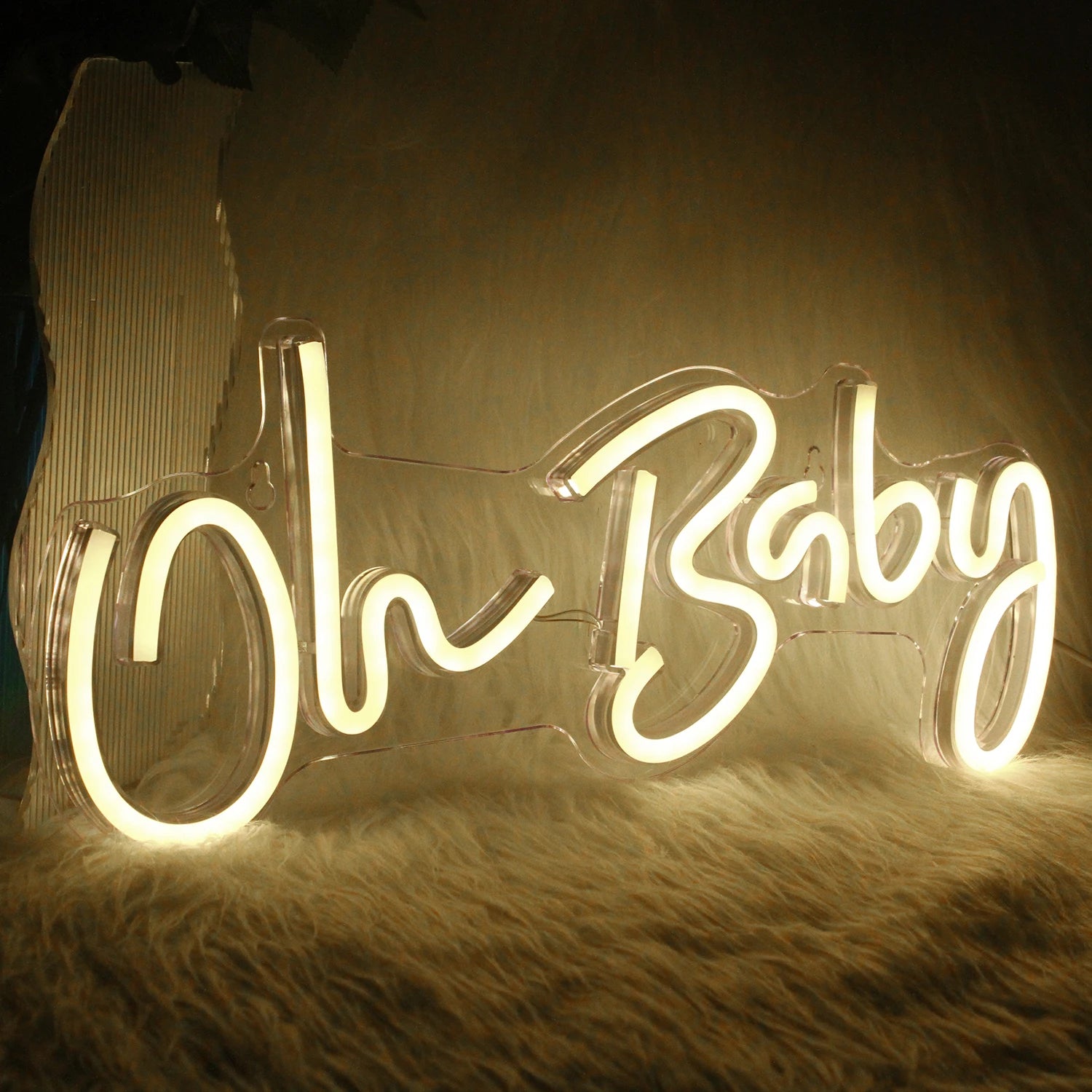 A vibrant "Oh Baby" LED neon sign featuring elegant, cursive lettering.