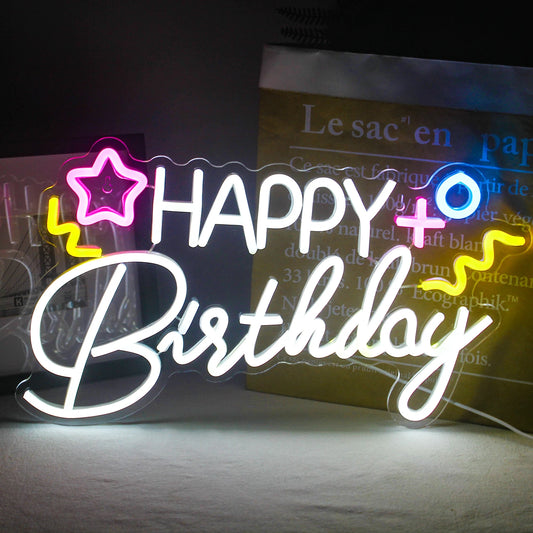 A vibrant "Happy Birthday" LED neon sign displayed against a dark background.