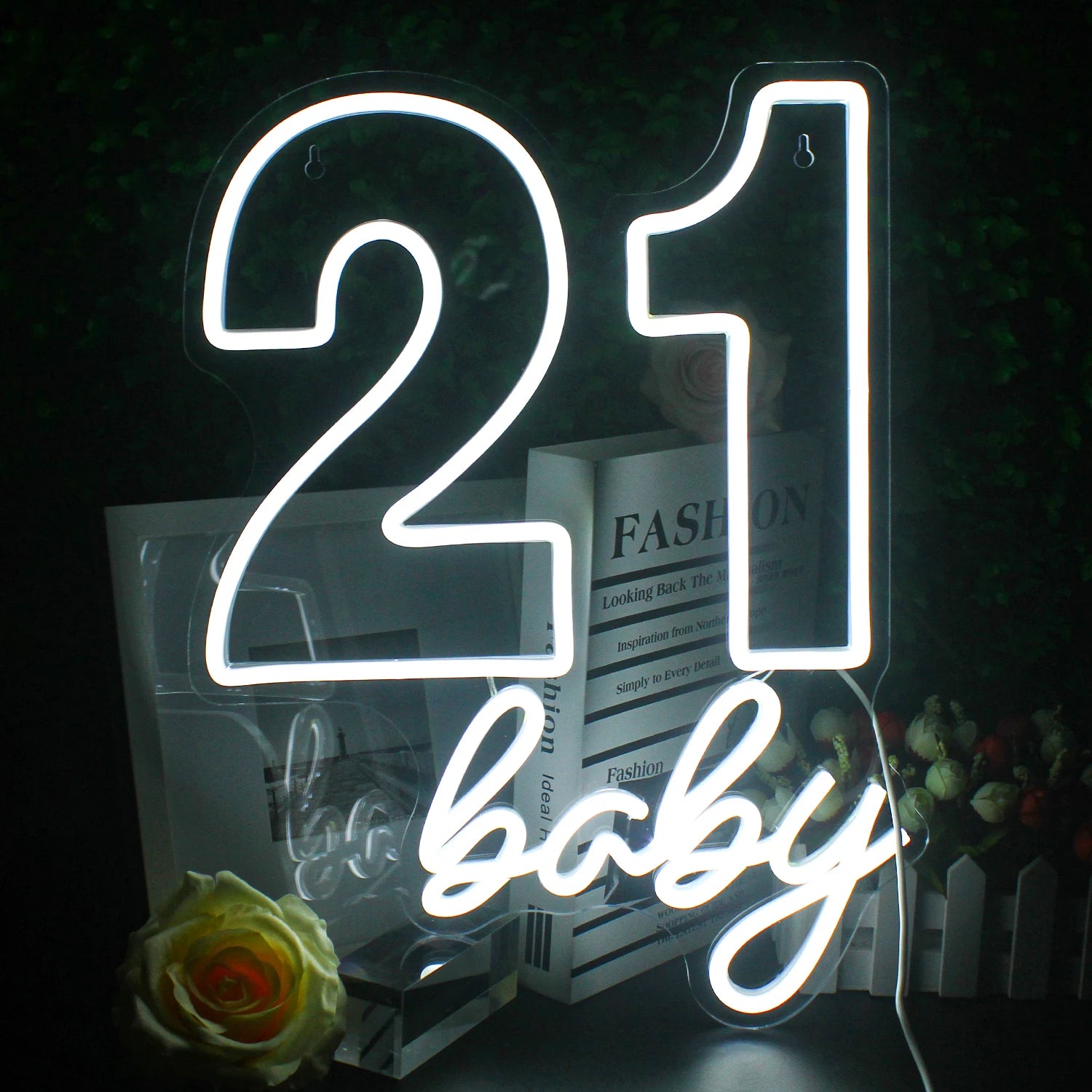 A vibrant LED neon sign displaying the words "Happy Birthday" in a playful, cursive font.