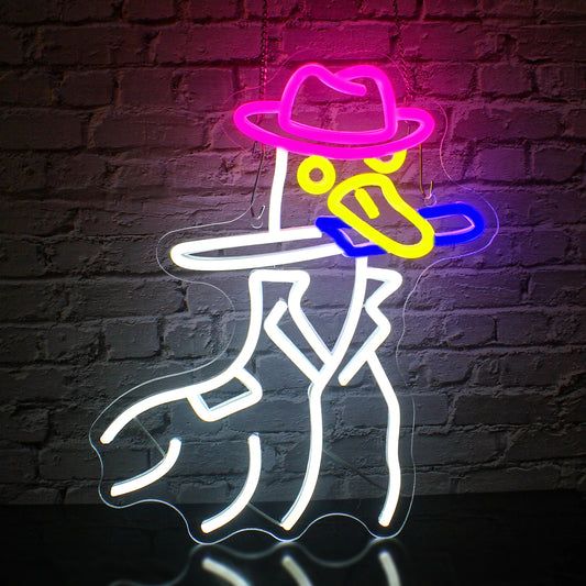 The image features a vibrant LED neon sign in the shape of a cowboy duck.