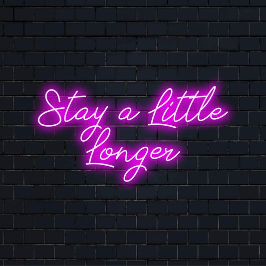 Custom made LED neon sign reading Stay A Little Longer; perfect neon wall art for adding personality to any space.