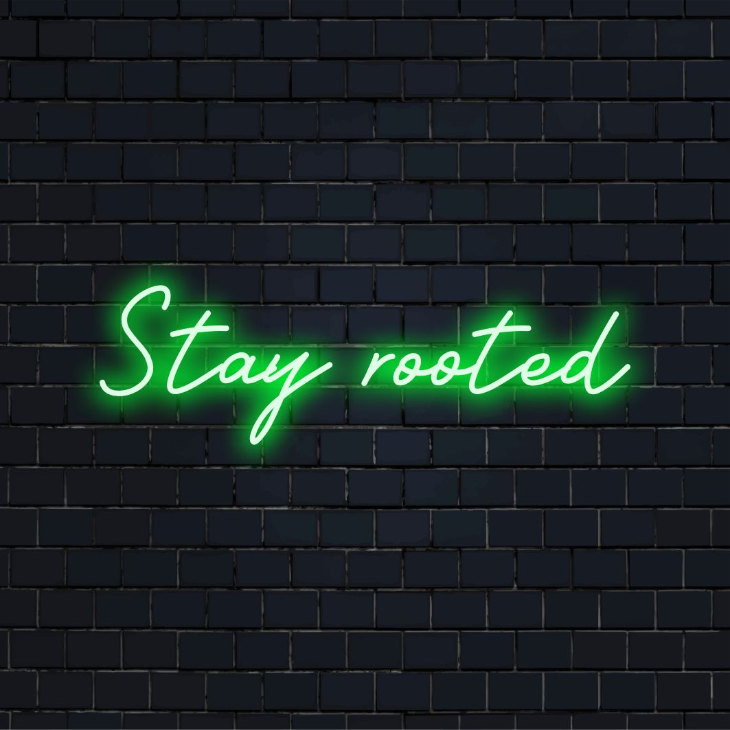 Placa de LED neon vibrante Stay Rooted personalizada, brilhando em branco, perfeita como decoração neon personalizada para casa ou como arte de parede marcante.