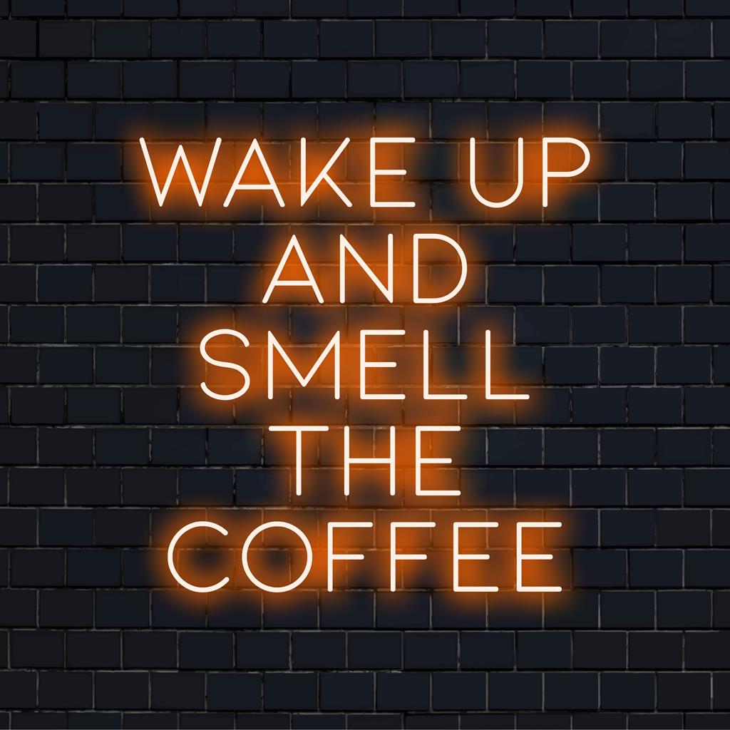 Custom LED neon sign with the phrase Wake Up And Smell The Coffee, perfect for adding energy and vibrant glow to any space.