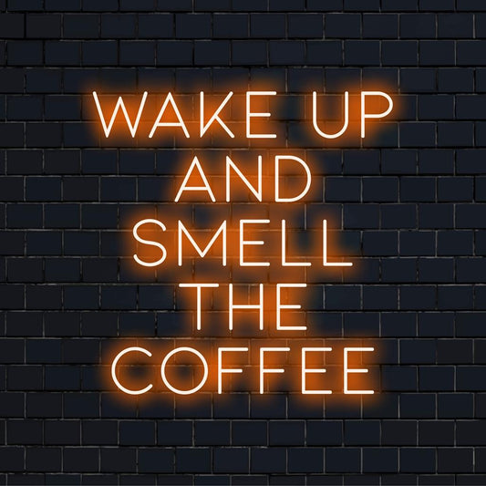 Custom LED neon sign with the phrase Wake Up And Smell The Coffee, perfect for adding energy and vibrant glow to any space.