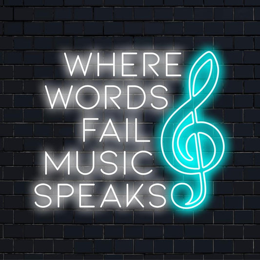 Illuminated message in glowing LED lights: Where Words Fail Music Speaks. A captivating neon sign with deep, expressive design.