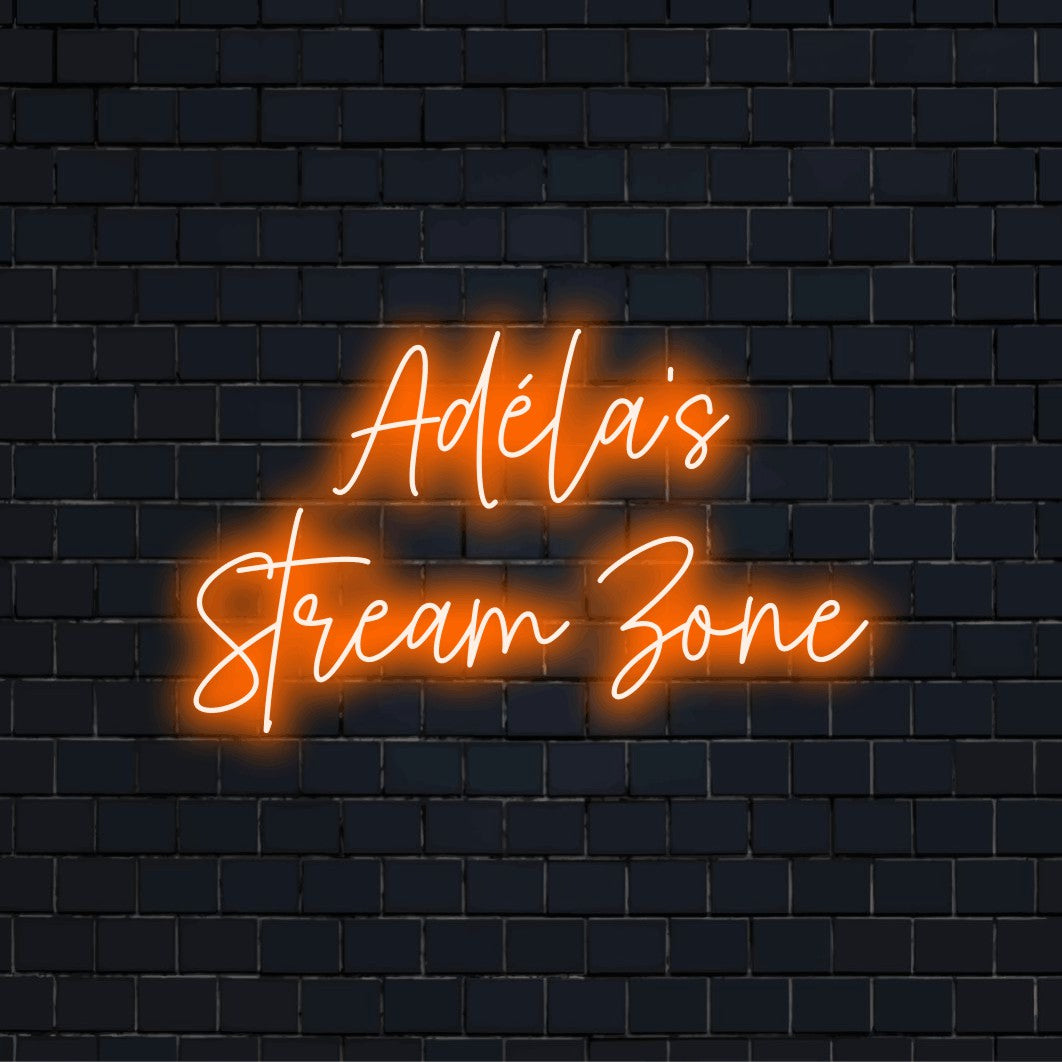 Adela_s Stream Zone Personalized LED Neon Sign, bright neon lettering on dark brick background