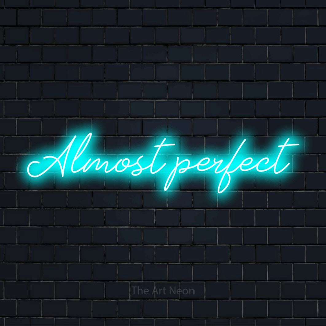 "Almost Perfect" text design with neon effect on a black brick wall