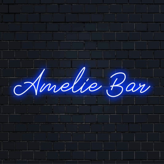 Amelie Bar Personalized LED Neon Sign, glowing lettering against black brick wall