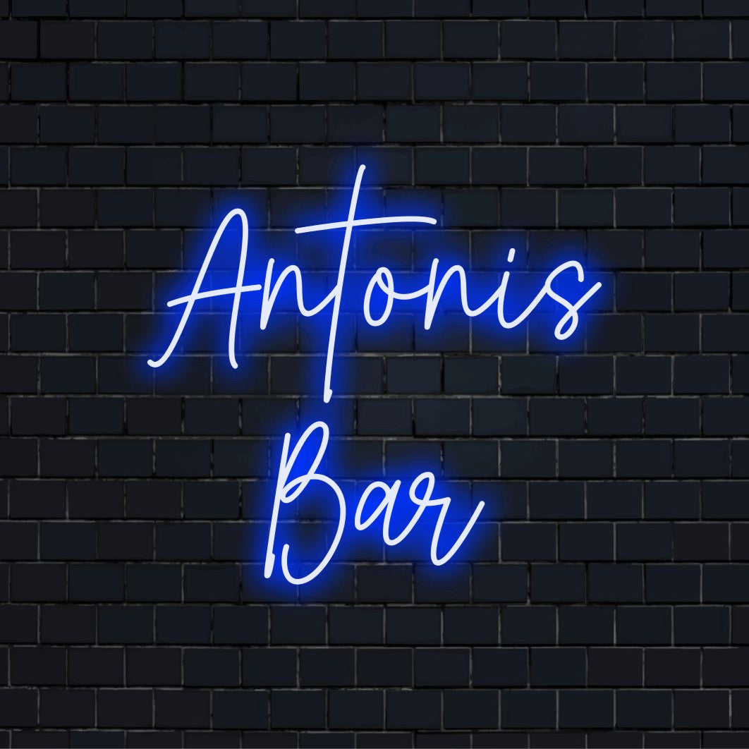 Antonis Bar Personalized LED Neon Sign, glowing lettering against black brick wall