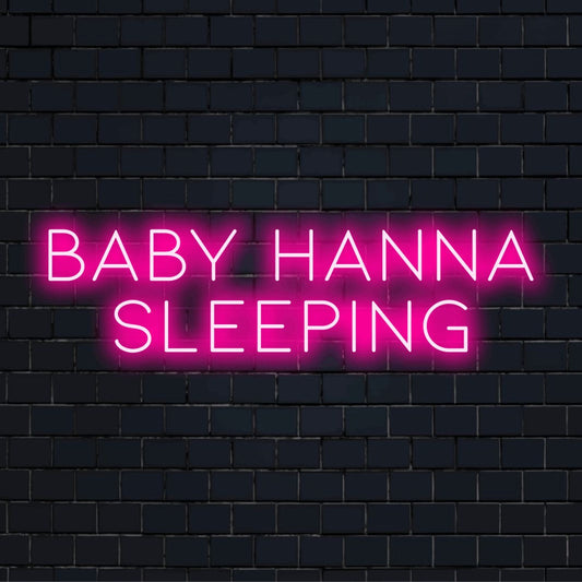 Baby Hanna Sleeping Personalized LED Neon Sign, bright LED glow against black brick wall