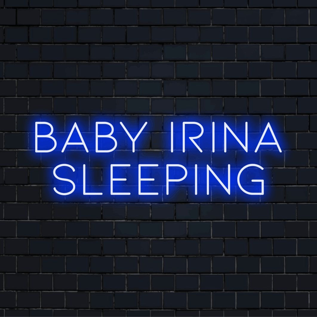 Baby Irina Sleeping Custom Name Neon Sign, bright neon glow on dark brick background