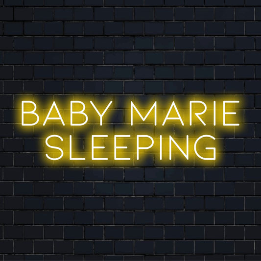 Baby Marie Sleeping Personalized Neon Light with bright neon lettering on dark brick wall