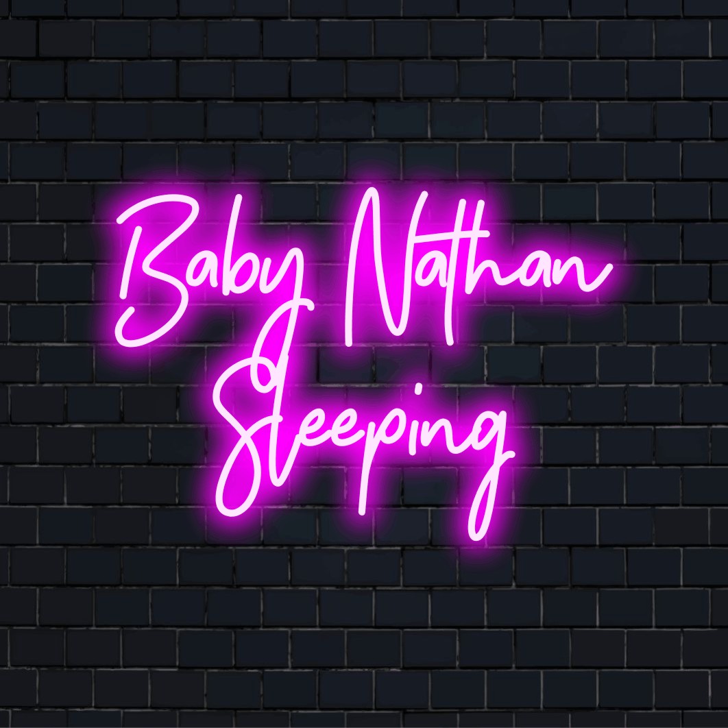 Baby Nathan Sleeping Custom Name Neon Sign, soft neon glow on dark brick background
