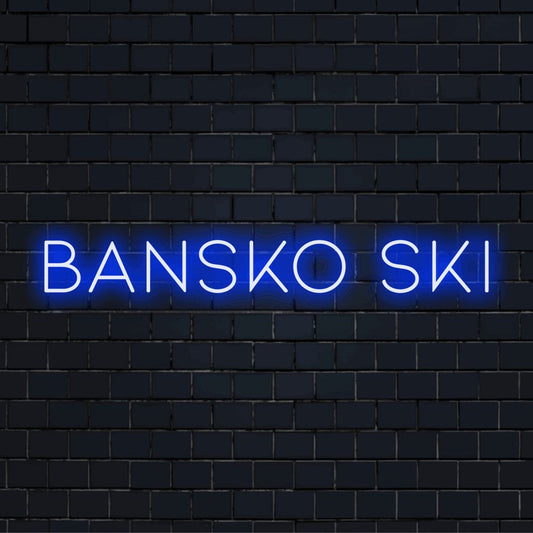 Bansko Ski LED Neon Sign, glowing wall decor against black brick wall