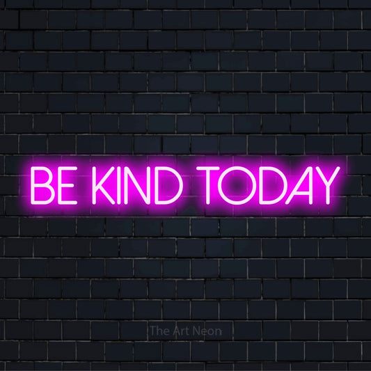 "Be Kind Today" LED neon sign on a black brick wall