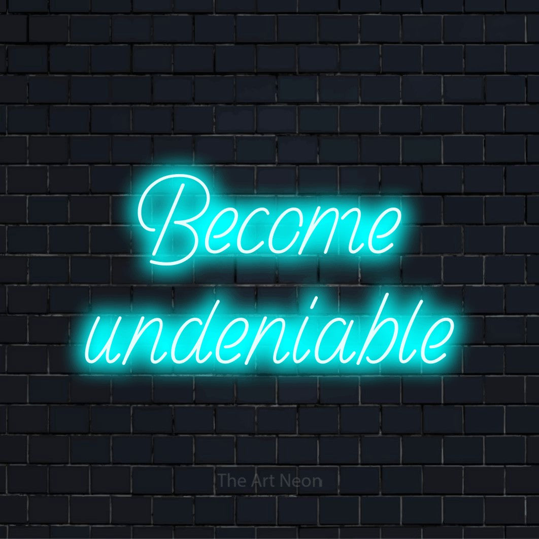 "Become Undeniable" LED neon sign on a black brick wall